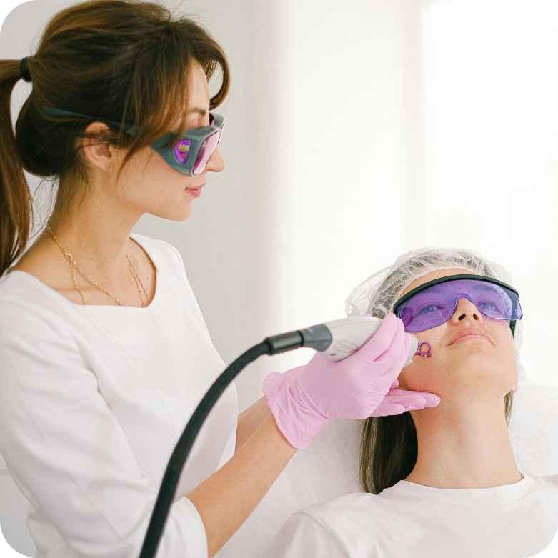 female cosmetic doctor doing procedure on patient